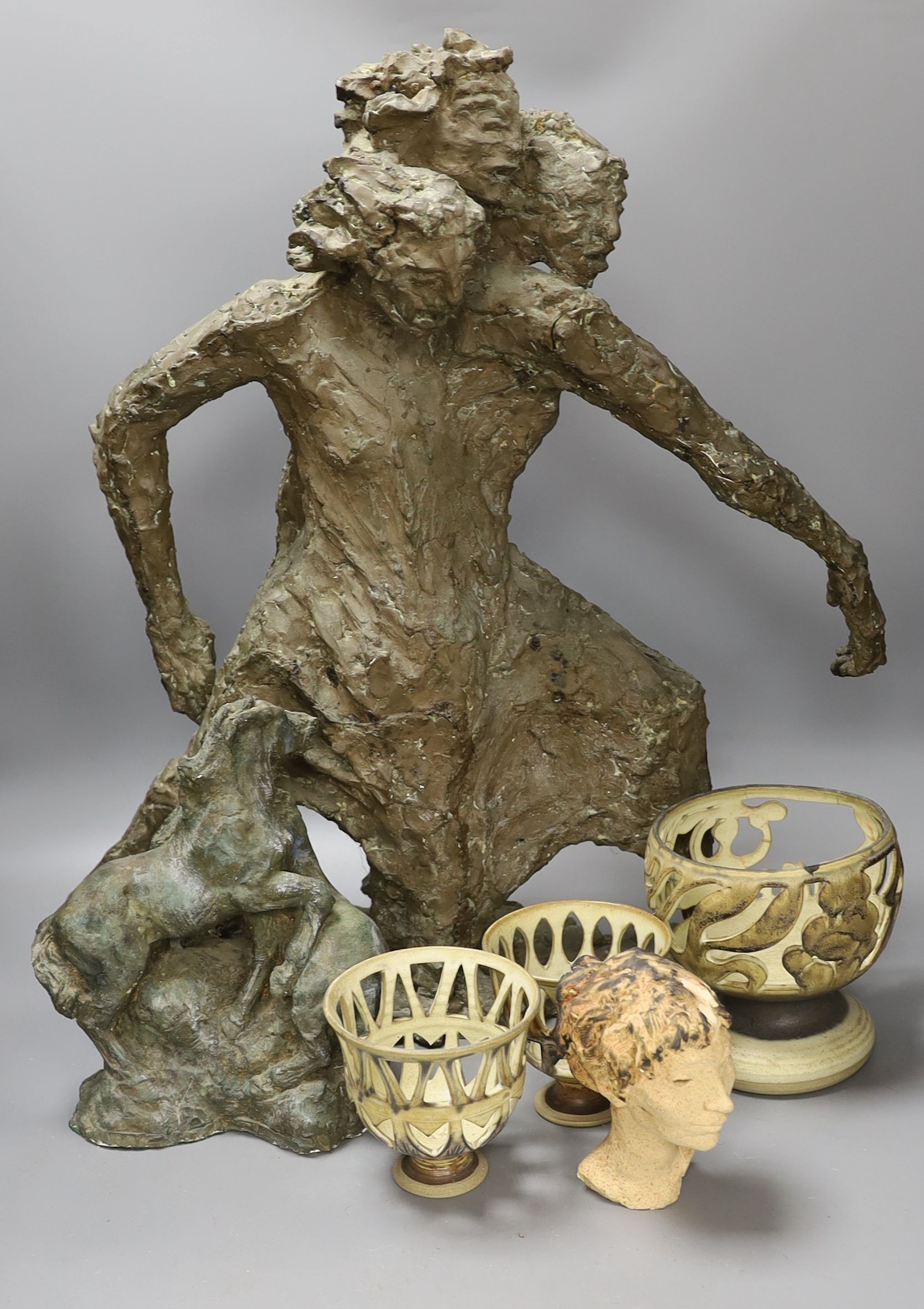 Leslie Charlotte Benenson RE (1941-2018), two bronzed fibreglass maquettes (a.f.), a clay head and three reticulated vessels (6), largest figure 58cms high.